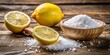© PloyJai - Citric acid, also known as lemon salt, displayed on a rustic wooden background