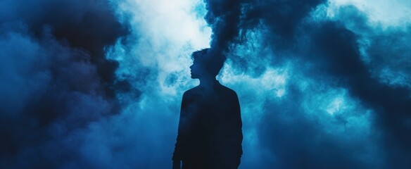 Silhouette of a Person Against a Blue Cloudy Sky