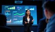 © Reubens Stock Photos - Confident Indian Female Executive Leading Presentation with Interactive Data Visuals