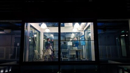 Aufkleber - Footage from Outside the Window: Managers and Specialists Having a Business Meeting in the Evening. Female Project Manager Making a Presentation with Analytics, Stats and Animated Reports
