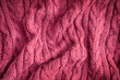 © Elena - Background made of top view of crumpled surface texture of casual comfortable woven handmade textile material knitted from wool, merino or cashmere soft warm yarn of dark purple colour used for cloth