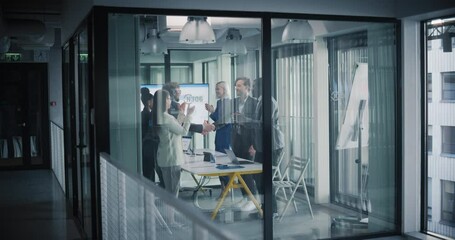 Aufkleber - Diverse Team Having a Business Meeting in a Conference Room. People Looking at the Analytical Data on Screen. Participants Agree on a Deal, Shake Hands and Celebrate a Successful Day in the Office