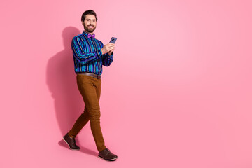 Poster - Full length photo of attractive elegant nice man wear stylish striped clothes empty space isolated on pink color background