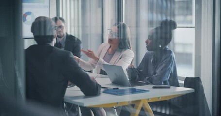 Aufkleber - Young Businessmen and Businesswomen Having Negotiations in the Office in a Glass Room. Female Entrepreneur Sitting Behind a Meeting Table, Discussing Statistics and Analytics Data with the Team