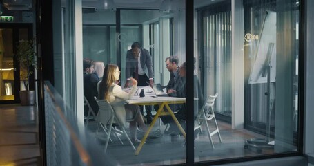 Aufkleber - African Manager Making a Presentation to a Diverse Board of Directors in a Glass Meeting Room in a Modern Office. Young Executives Discussing New Investment Strategy with Corporate Partners