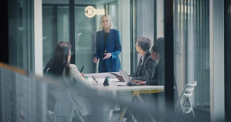 Poster - Team of Female and Male Managers Having a Discussion with a Corporate Business Adviser in an Office Meeting Room. Group of Businesspeople Analyzing Financial Reports, Brainstorming New Ideas