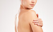 © Nina2024/peopleimages.com - Woman, shoulder and smooth skin in studio, body treatment and hydration glow for skincare. Female person, soft beauty and cosmetics shine for dermatology, bodycare and clear on white background