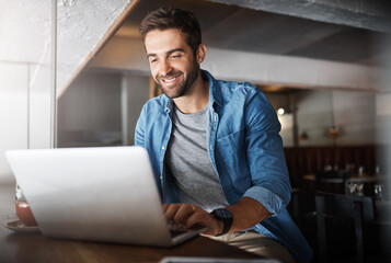 Poster - Laptop, remote work and typing with man in coffee shop for networking or online research. Computer, freelance employment and smile of happy customer in cafe or restaurant for hospitality or service
