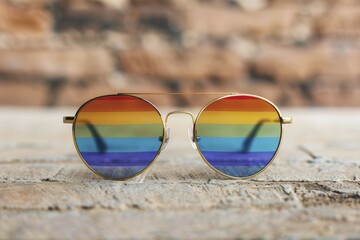 Stylish sunglasses featuring pride colors, adding a fashionable accessory to any pride celebration outfit.