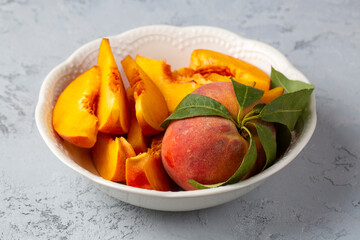 Wall Mural - Fresh delicious peaches in a bowl