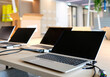 © lensw0rld - Laptops on a table in a co-working space