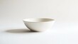 © Matcha_09 - Clean white background with a single ceramic bowl, placed neatly in the center