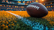 © danielkosh - American football is resting on a field with stadium lights at sunset
