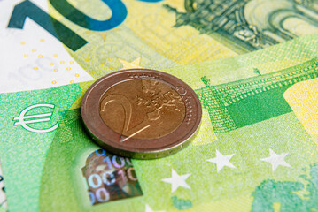 Part of Euro current money and two coin background, European Union money sign.