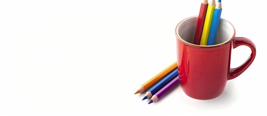 Poster - Colored pencils and a portion of a mug on a white background Copy space