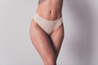 © deagreez - Cropped photo of young lady hips belly dressed white lingerie no filter self acceptance all body perfect isolated on gray color background