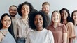 © VK Studio - A diverse group of people stands together, smiling warmly, embodying unity and inclusivity, captured in a brightly lit and welcoming setting.