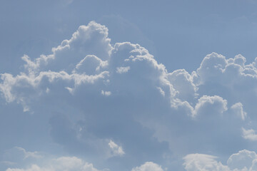 Wall Mural - the sky is filled with fluffy white clouds, creating a serene