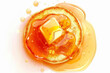 © Duka Mer - An illustration of pancakes with syrup and butter from a top-down view on a white backdrop.