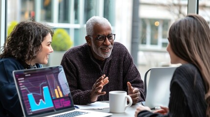 The old man discusses retirement plans and life insurance options with the professional banker, who offers financial advice in a modern office. Camera B.