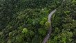 © Hand Robot - Aerial view of road in the middle of the forest , Top view road curve construction up to mountain, Rainforest ecosystem and healthy environment concept