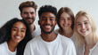 © Juliana Valkovskaya - Happy young people of different nationalities are happy and smiling, on a white background. AI generation