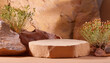 © hardvicore - Empty sandstone podium surrounded by desert flora, rocky wall on backdrop. Presentation scene
