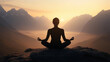 © Andres Mejia - Woman meditating in lotus pose on mountain top at sunrise