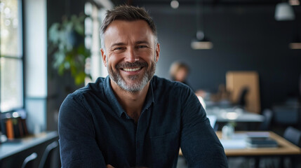 Aufkleber - Happy businessman smiling while working in modern office
