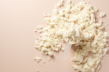 Protein powder. Vanilla flavour of protein powder in a scoop, closeup.