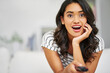© peopleimages.com - Remote, shock and woman in home with television for watching film, show or movie on weekend. Happy, tv and female person streaming comedy series online with app or website in living room of apartment