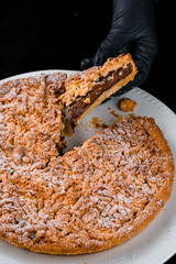 Wall Mural - Crumbly pie stuffed with chocolate and powdered sugar.