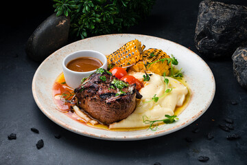 Poster - Fresh filet mignon beef steak with mashed potatoes, corn, tomatoes and sauce.