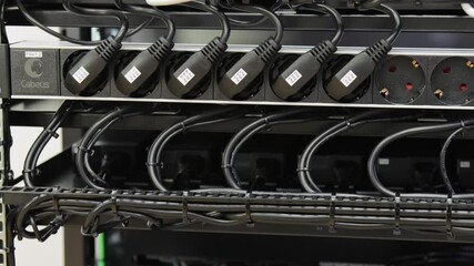 Wall Mural -  socket units with connected power supply wires for equipment in a telecommunications rack.