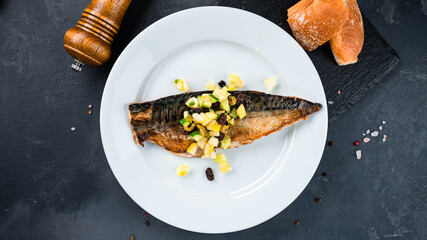 Canvas Print - Fried fish with cucumbers, apple, raisins and olives.