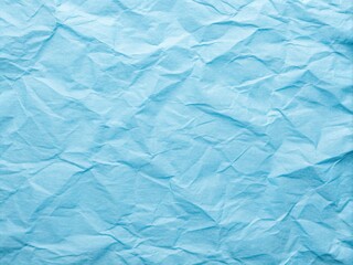 Soft, calming blue paper texture with subtle wrinkles and faint grid lines, perfect for adding warmth to graphic design and website backgrounds.