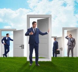 Wall Mural - Businessman in uncertainty concept with many doors