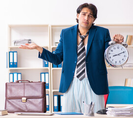 Wall Mural - Employee coming to work straight from bed