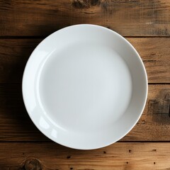 Wall Mural - Empty White Ceramic Plate on Rustic Wooden Table, Overhead View.