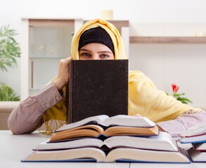 Wall Mural - Female student in hijab preparing for exams