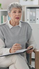 Poster - Mature woman, therapist and consulting with clipboard on sofa for advice, notes or assessment at clinic. Female person, psychiatrist or psychologist talking to patient for healthcare, support or help