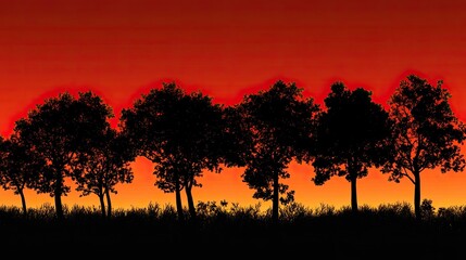 Silhouette of trees against a fiery sunset, perfect for copy space.