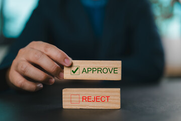 Poster - Option to approve or reject on wooden blocks. Businessman select wooden block with text Approve for document approval , project assessment evaluation acceptance, and quality assurance.