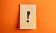 © Farid - Note paper with exclamation mark on panoramic orange background.