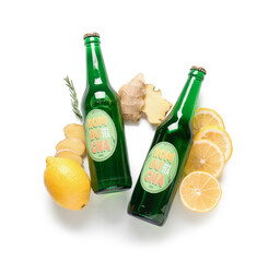 Wall Mural - Bottles of tasty kombucha tea with lemon and ginger on white background