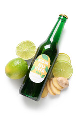 Canvas Print - Bottle of tasty kombucha tea with lime and ginger on white background