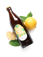 Canvas Print - Bottle of tasty kombucha tea with lemon and ginger on white background