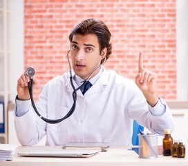 Wall Mural - Young doctor working in hospital