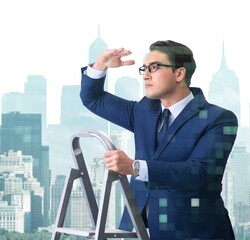 Wall Mural - Businessman climbing ladder in business concept