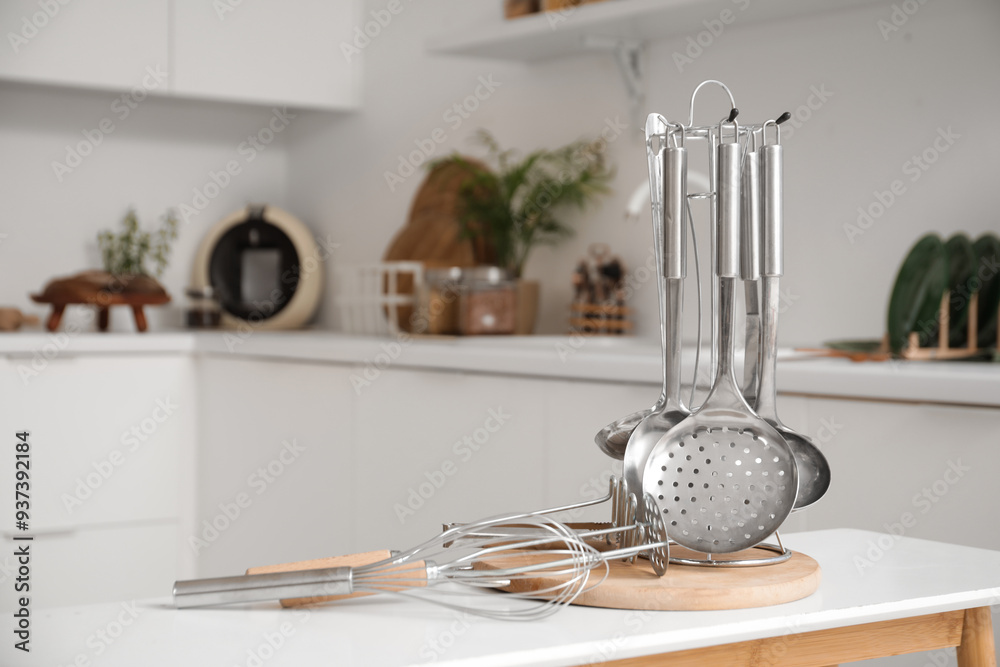 Cooking utensils on table in kitchen